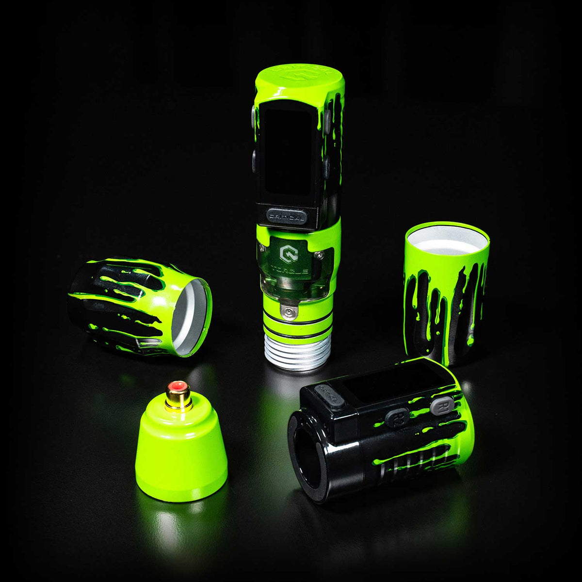 Collection of green and black Critical Torque components on a black background