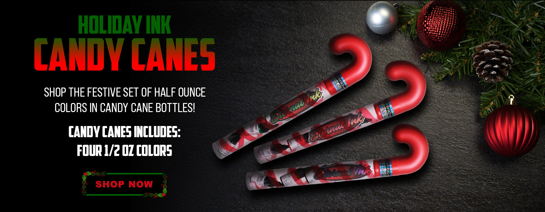 Red Eternal Ink candy canes with festive design on a dark surface with Christmas decorations.