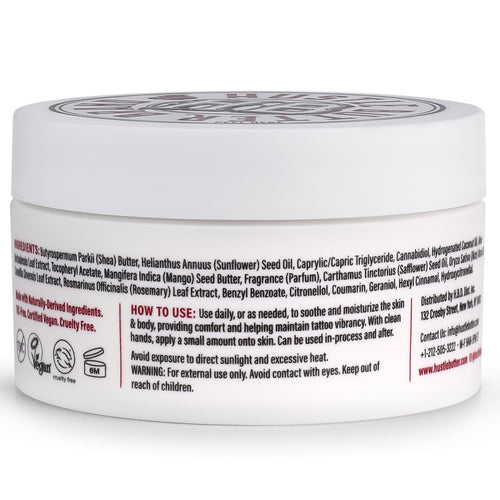 Hustle Butter tattoo balm jar with visible branding on a white background