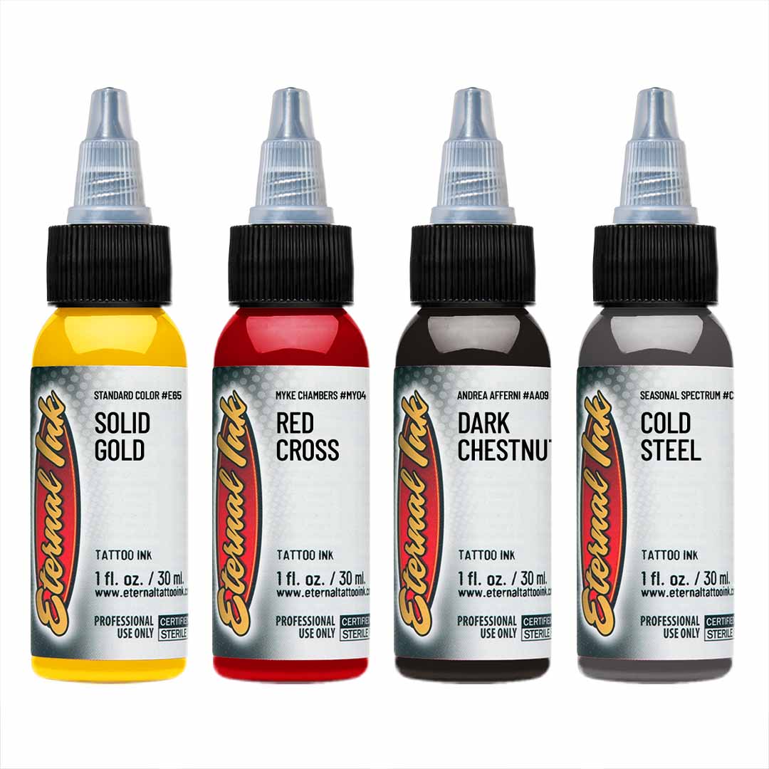 Four bottles of Eternal Ink tattoo ink with different colors on a white background