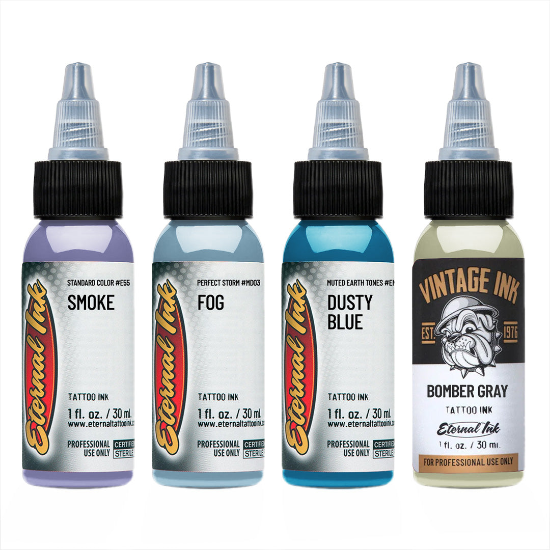Four bottles of Eternal Ink tattoo ink with different colors on a white background